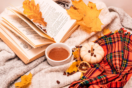 Autumn composition book, cup of coffee, pumpkin and leaves