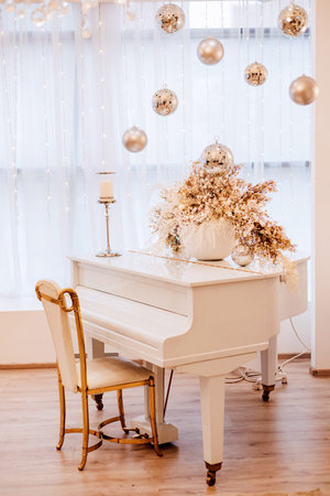 White luxury grand piano in a bright New Years interiorの写真素材