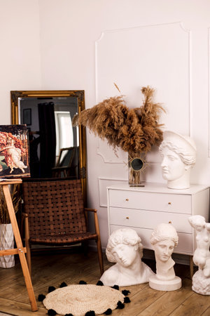 Modern interior with white chest of drawers and mirrorの写真素材