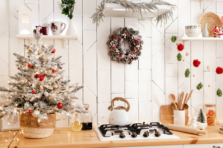 Beautiful modern white kitchen with Christmas decorの写真素材