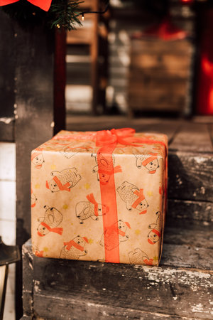 A box with a gift on a wooden porch. Boxing Dayの写真素材