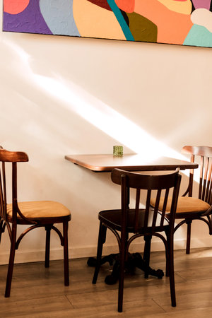 Wooden table in the cafe and chairs. Loft style