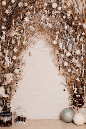 Beautiful New Years arch indoors in gold and silver shades