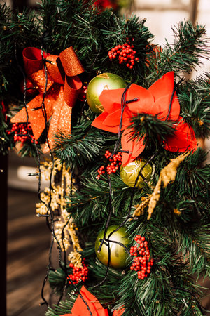 Christmas decorations and Christmas tree branches on the fence on the streetの写真素材
