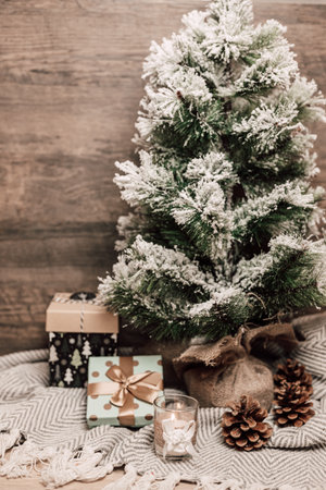 Christmas tree with gifts and candle. Christmas tree on the table. High quality photoの写真素材