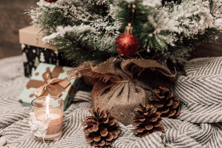 Christmas tree with gifts and candle. Christmas tree on the table. High quality photoの写真素材