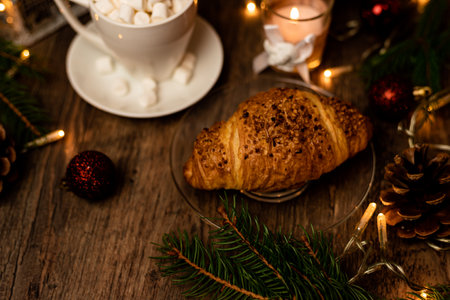 Christmas sweets. Croissant and marshmallow on the New Year's table. Romantic Family Evening. High quality photoの写真素材