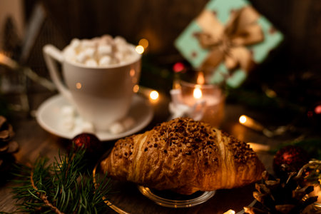 Christmas sweets. Croissant and marshmallow on the New Year's table. Romantic Family Evening. High quality photoの写真素材