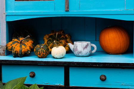 Ingathering. Pumpkins are lying on the table. Lots of pumpkins on the market. High quality photoの写真素材