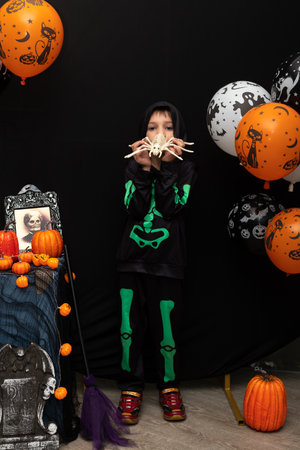 Halloween. A boy in a skeleton costume. Celebrating Halloween. High quality photoの写真素材