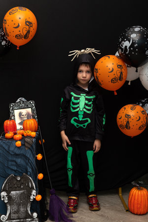 Halloween. A boy in a skeleton costume. Celebrating Halloween. High quality photoの写真素材