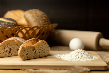 Sliced bread, flour, egg on the table. The process of making bread. Fresh pastries. High quality photoの写真素材