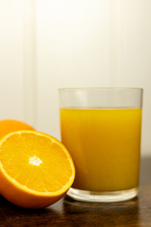 A healthy smoothie in a glass with oranges and lime. Glass of orange juice. High quality photoの写真素材