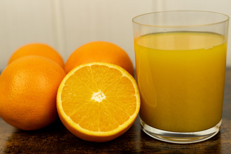 A healthy smoothie in a glass with oranges and lime. Glass of orange juice. High quality photoの写真素材