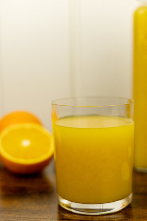 A healthy smoothie in a glass with oranges and lime. Glass of orange juice. High quality photoの写真素材
