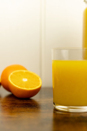 A healthy smoothie in a glass with oranges and lime. Glass of orange juice. High quality photoの写真素材