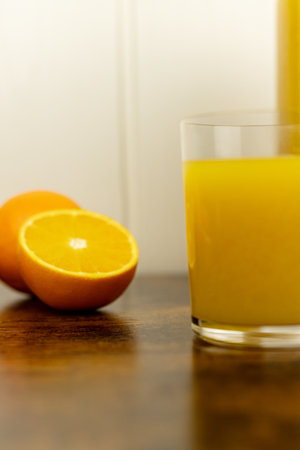 A healthy smoothie in a glass with oranges and lime. Glass of orange juice. High quality photoの写真素材