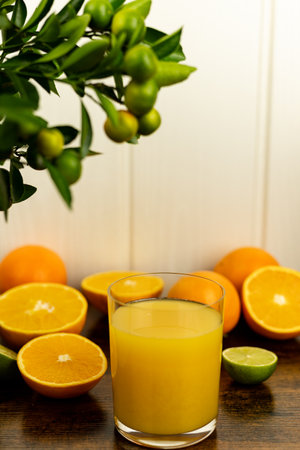 Glass of freshly squeezed orange juice, close-up of sliced oranges. High quality photoの写真素材
