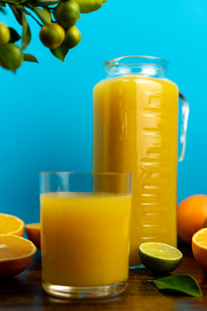 Glass of freshly squeezed orange juice, close-up of sliced oranges. High quality photoの写真素材