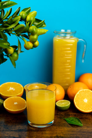 Glass of freshly squeezed orange juice, close-up of sliced oranges. High quality photoの写真素材