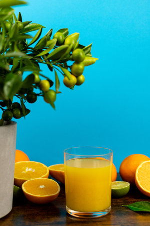 Sliced oranges, a close-up glass of freshly squeezed orange juice. Fresh juice. High quality photoの写真素材