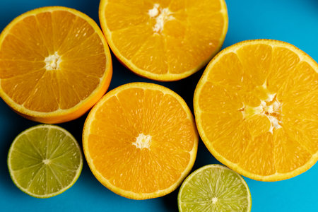 Cut oranges on a blue background close-up. High quality photoの写真素材