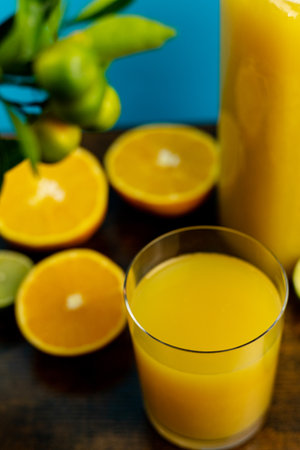 Glass of orange juice view from above. Half an orange and a glass of juice close-up. High quality photoの写真素材