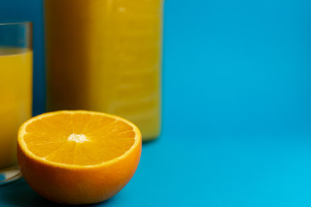 Close-up of freshly cut orange and glass of freshly squeezed juice. High quality photoの写真素材
