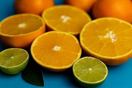 Cut oranges on a blue background close-up. High quality photoの写真素材
