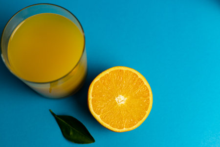 Close-up of freshly cut orange and glass of freshly squeezed juice. High quality photoの写真素材