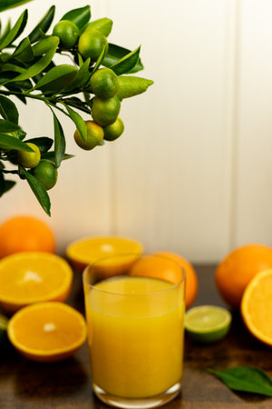 Close-up of cut oranges on a table. Orange juice in a glass. High quality photoの写真素材