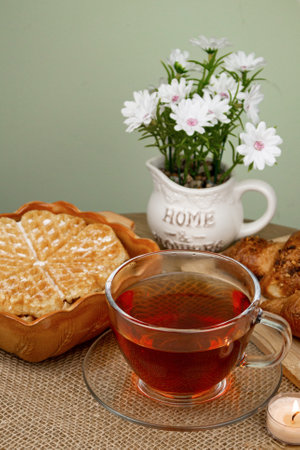 Delicious homemade waffles. Waffle and tea on the table. Homemade breakfast. High quality photoの写真素材