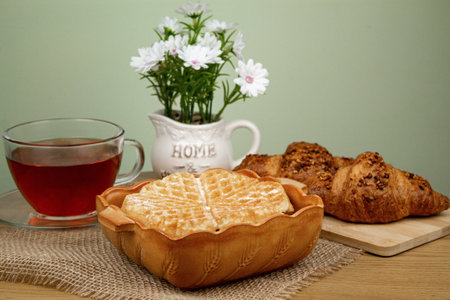 Delicious homemade waffles. Waffle and tea on the table. Homemade breakfast. High quality photoの写真素材