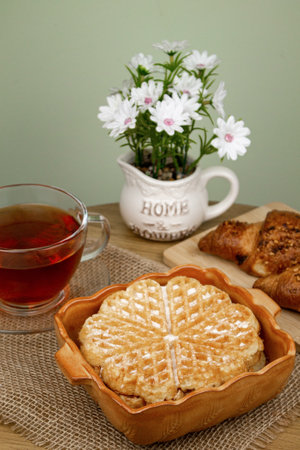 Delicious homemade waffles. Waffle and tea on the table. Homemade breakfast. High quality photoの写真素材