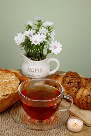 Croissants and tea on the table, view from above. Delicious aromatic breakfast. High quality photoの写真素材