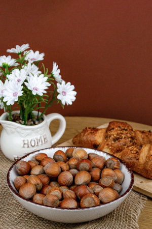 Croissants and hazelnuts on the table. Delicious healthy breakfast. Top view. High quality photoの写真素材