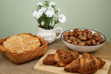 Croissants and hazelnuts on the table. Delicious healthy breakfast. Top view. High quality photoの写真素材