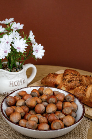 Croissants and hazelnuts on the table. Delicious healthy breakfast. Top view. High quality photoの写真素材