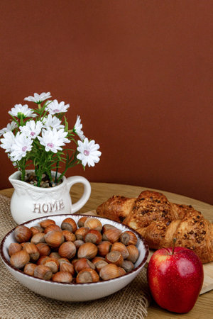 Croissants and hazelnuts on the table. Delicious healthy breakfast. Top view. High quality photoの写真素材
