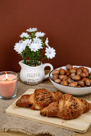 Croissants and hazelnuts on the table. Delicious healthy breakfast. Top view. High quality photoの写真素材