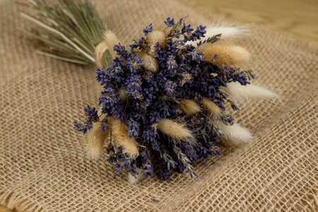 Bouquet of dried lavender. Dried flowers on burlap. Bouquet of dried flowers. High quality photoの写真素材