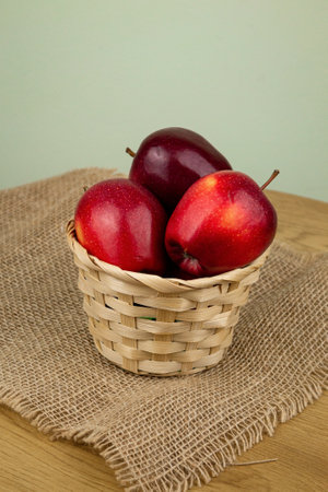 Red beautiful apples in a basket on the table. Red apples. Apple diet. High quality photoの写真素材
