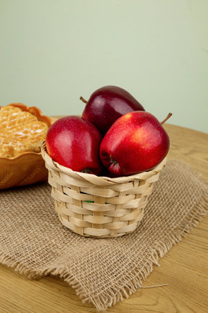 Red beautiful apples in a basket on the table. Red apples. Apple diet. High quality photoの写真素材