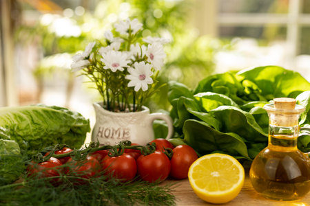 Red tomatoes, lettuce leaves on the table close-up. Vegetables for salad on the kitchen table. High quality photoの写真素材