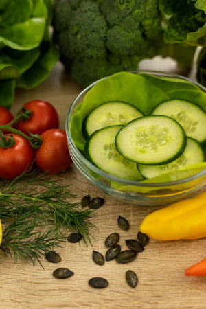 Red tomatoes, lettuce leaves on the table close-up. Vegetables for salad on the kitchen table. High quality photoの写真素材