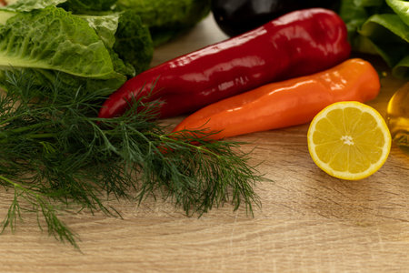 Cut lemon, red pepper. Fresh vegetables for salad in the kitchen. Proper nutrition. High quality photoの写真素材