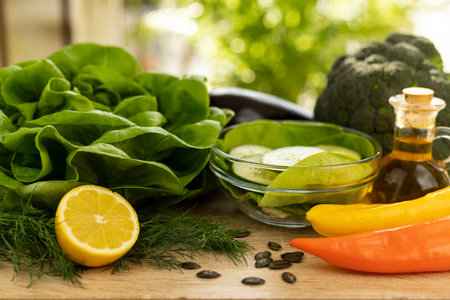 Vegetables from the garden. Ingathering. Making salad at home in the kitchen. High quality photoの写真素材