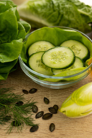 Vegetables from the garden. Ingathering. Making salad at home in the kitchen. High quality photoの写真素材