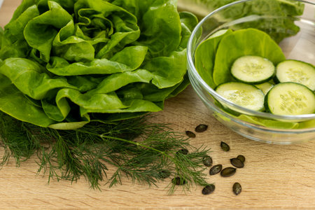 Vegetables from the garden. Ingathering. Making salad at home in the kitchen. High quality photoの写真素材