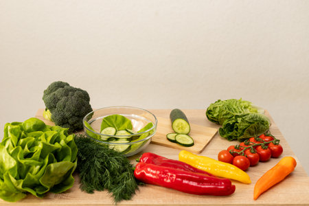 Vegetables from the garden. Ingathering. Making salad at home in the kitchen. High quality photoの写真素材
